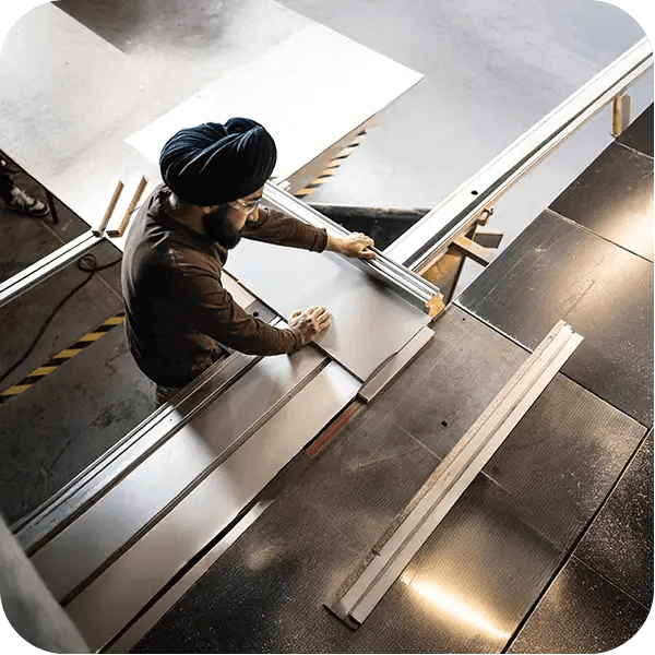 A man engaged in metalworking at a factory