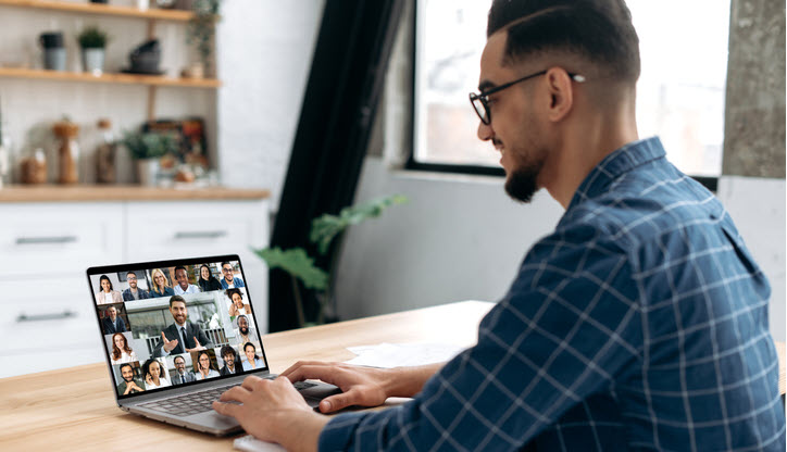 Smart indian or arabian guy meet with a group of multiracial colleagues gathered in a video conference to communicate and discuss work issues and new project, planning business plan